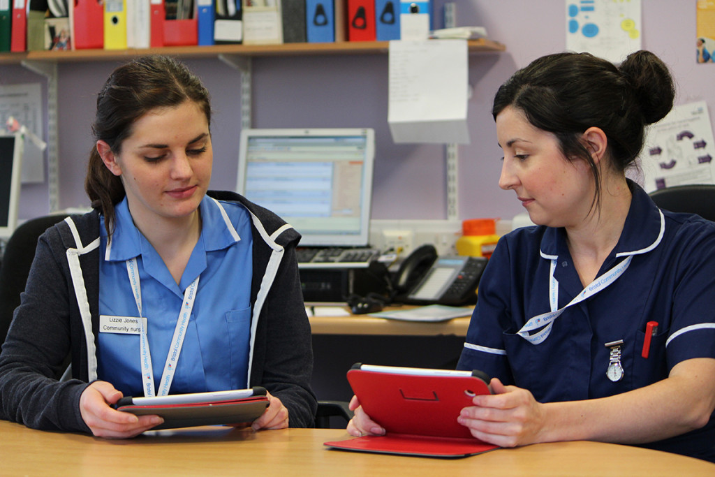 two nurses with tablets