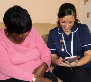 nurse and patient with tablet device